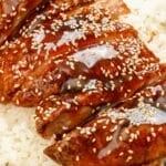 Honey Butter Chicken on a bed of rice in a bowl.