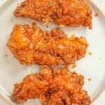 Crispy Hot Honey Chicken Tenders on a plate.