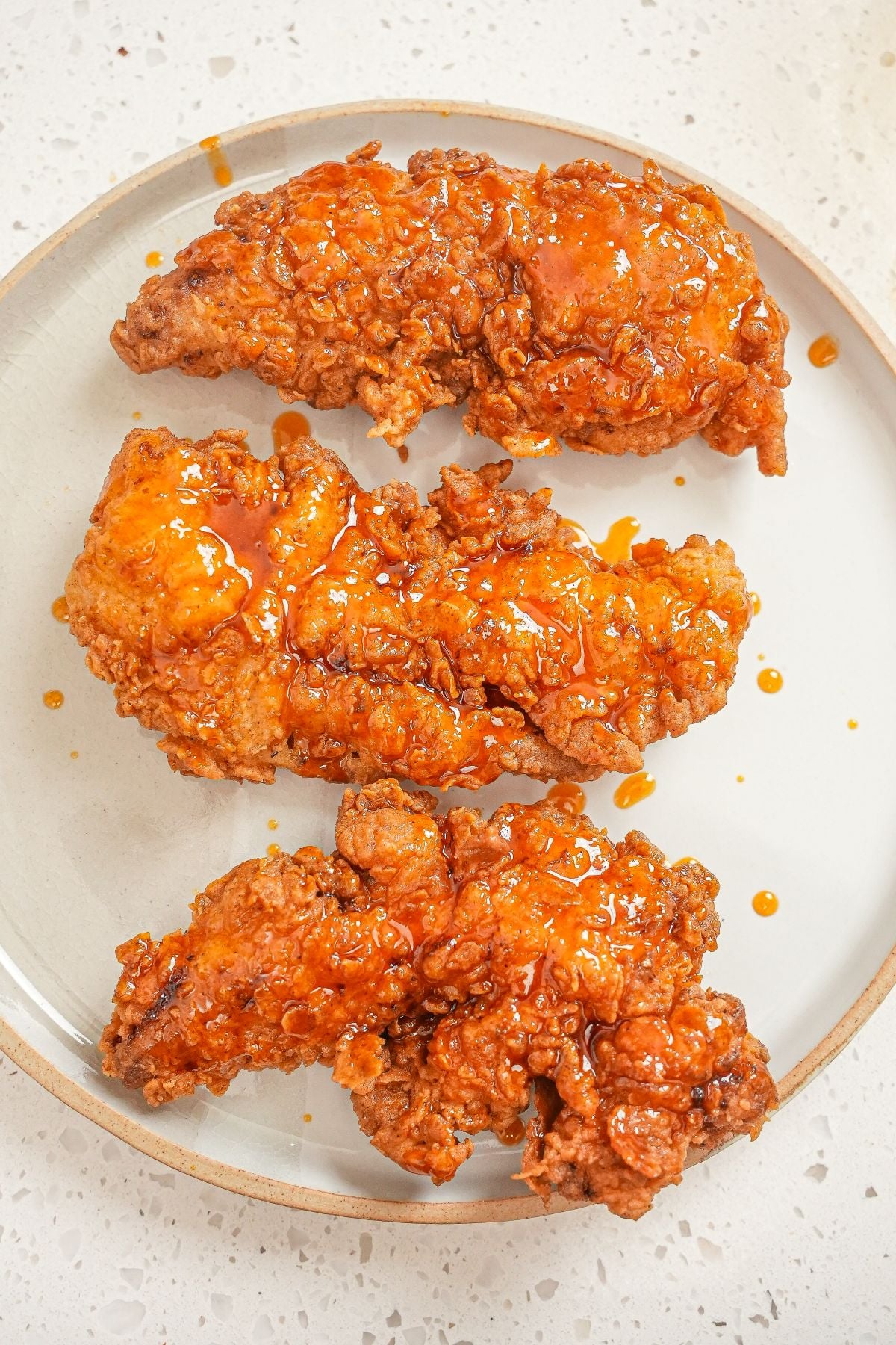 Crispy Hot Honey Chicken Tenders on a plate.