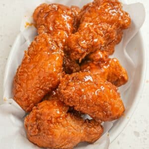 Crispy Hot Honey Chicken Wings in a white bowl.