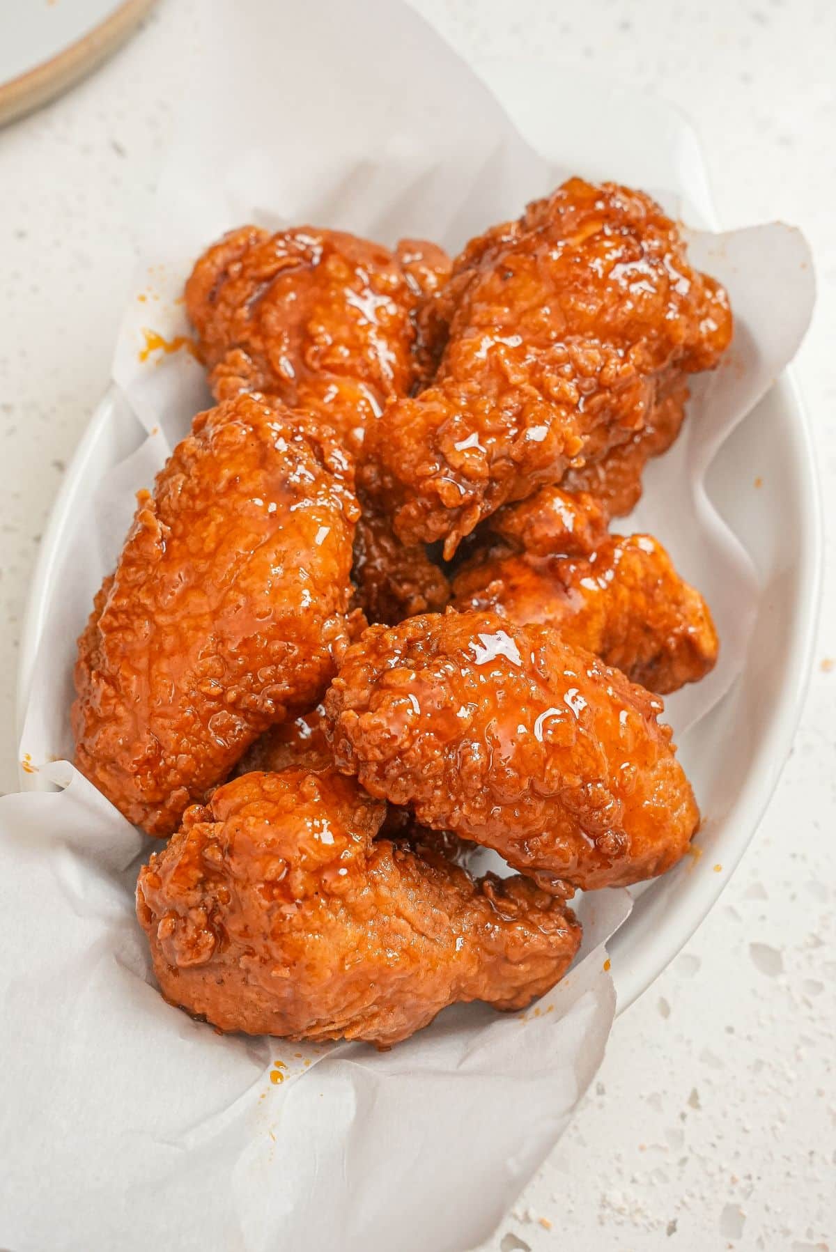 Crispy Hot Honey Chicken Wings in a white bowl.