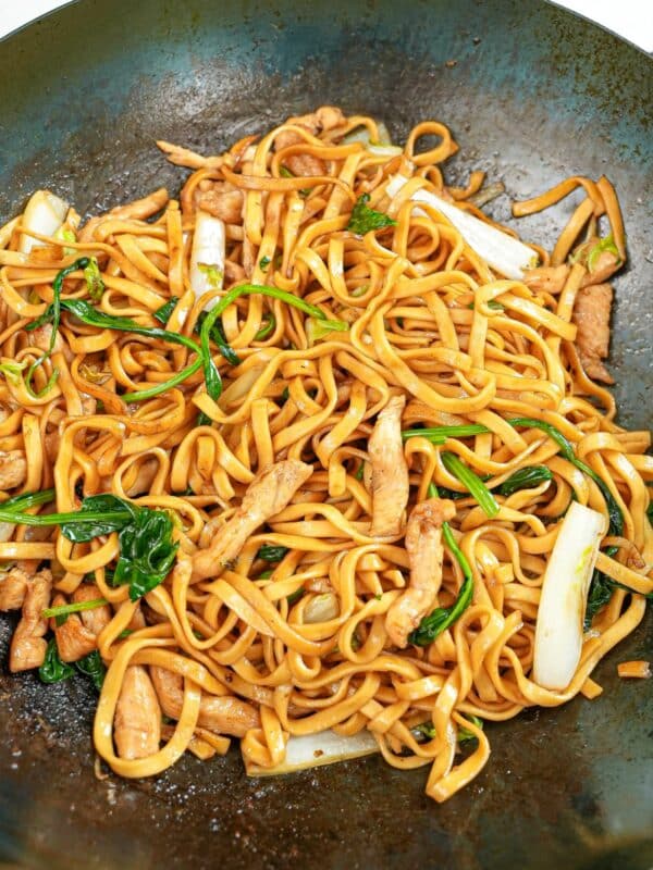 Din Tai Fried Noodles with Chicken cooked in a wok.