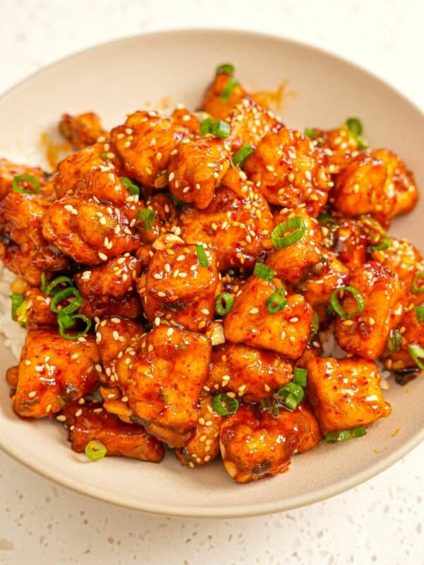 Crispy General Tso's Tofu in a bowl over rice.